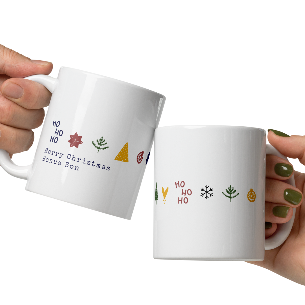 Two hands holding white mugs with colorful designs on a white background