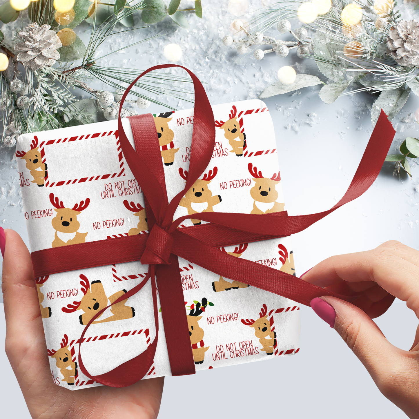 Gift wrapped in festive paper with reindeer design and red ribbon, set against a Christmas tree background.