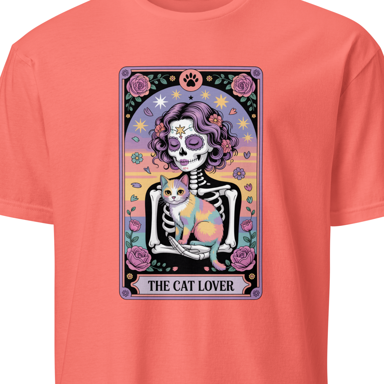 Coral t-shirt with a colorful graphic of a skeleton holding a cat and the text 'The Cat Lover'