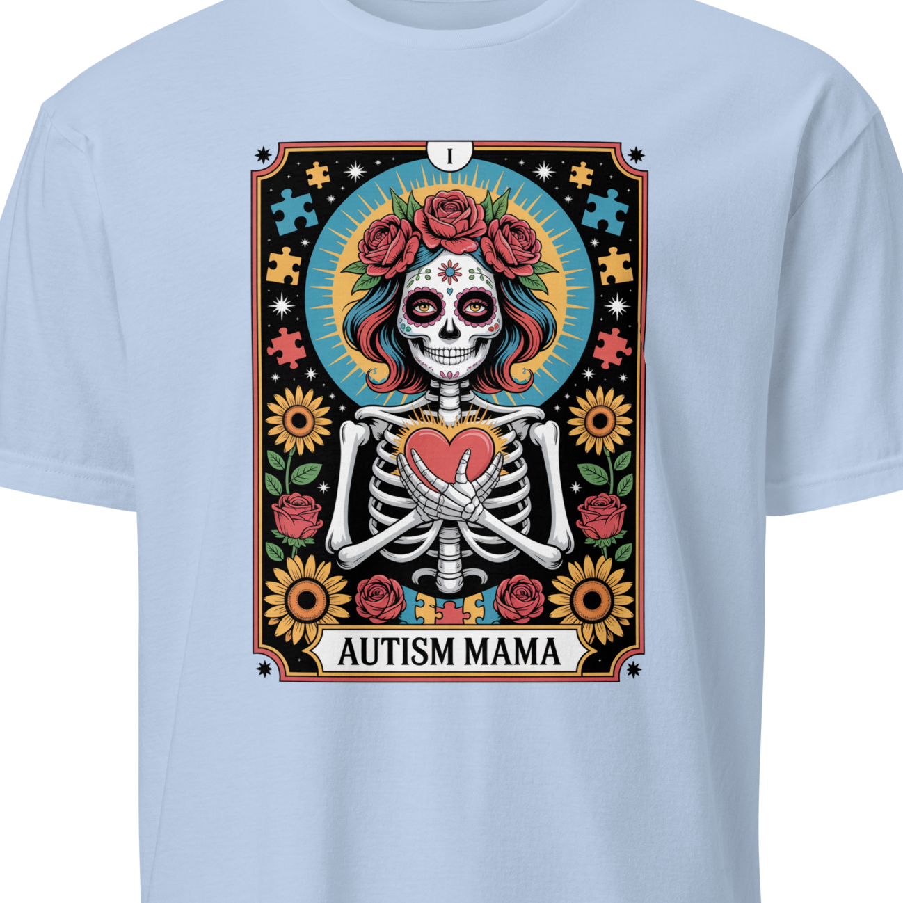 Light blue t-shirt with a colorful graphic design featuring a skeleton and text 'Autism Mama' 