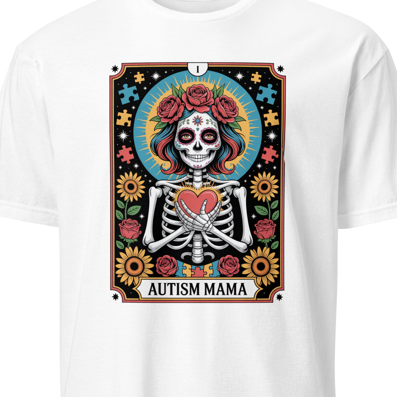White t-shirt with a colorful graphic of a skeleton holding a heart, surrounded by flowers and the text 'Autism Mama' 