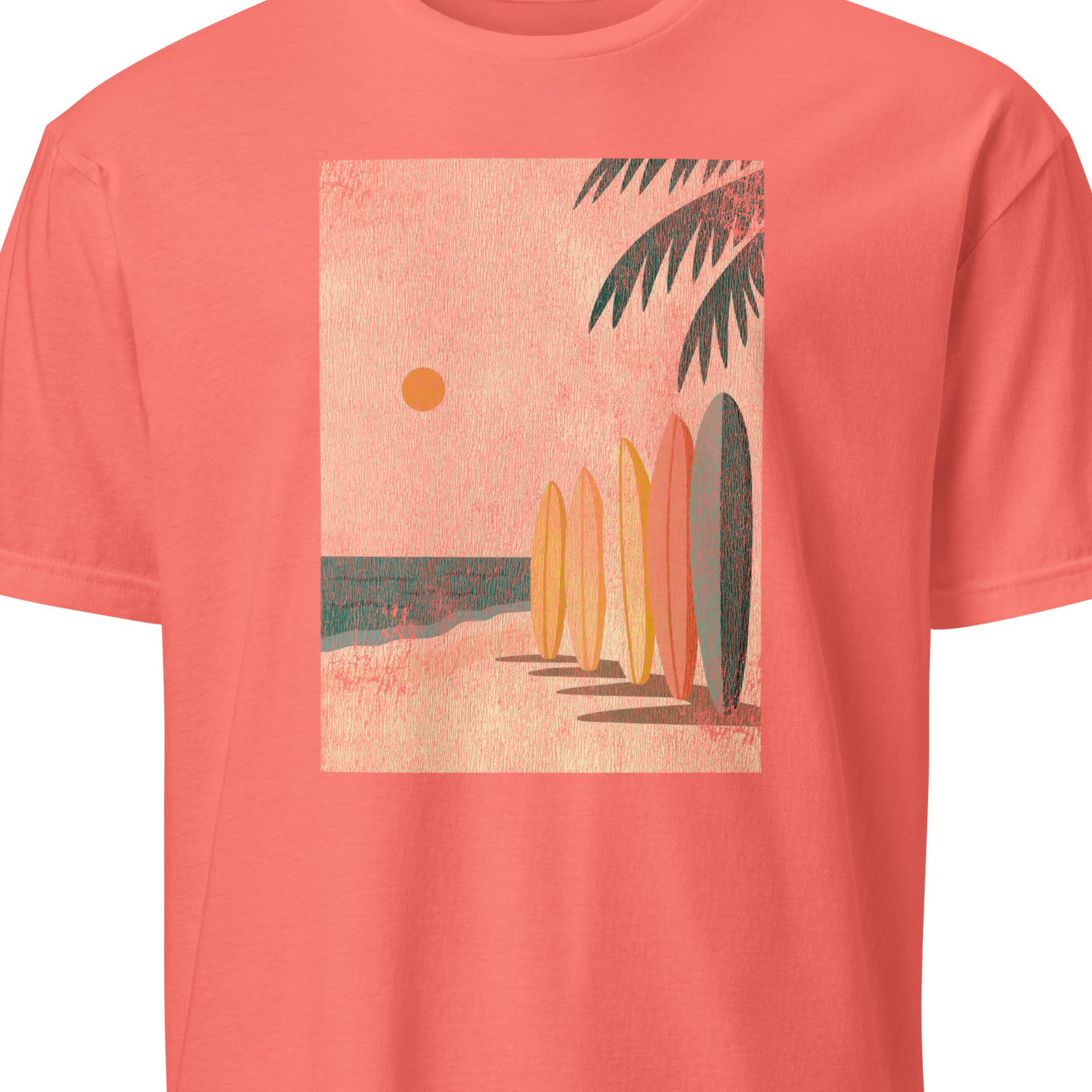 Coral t-shirt with a beach graphic featuring surfboards and palm trees 