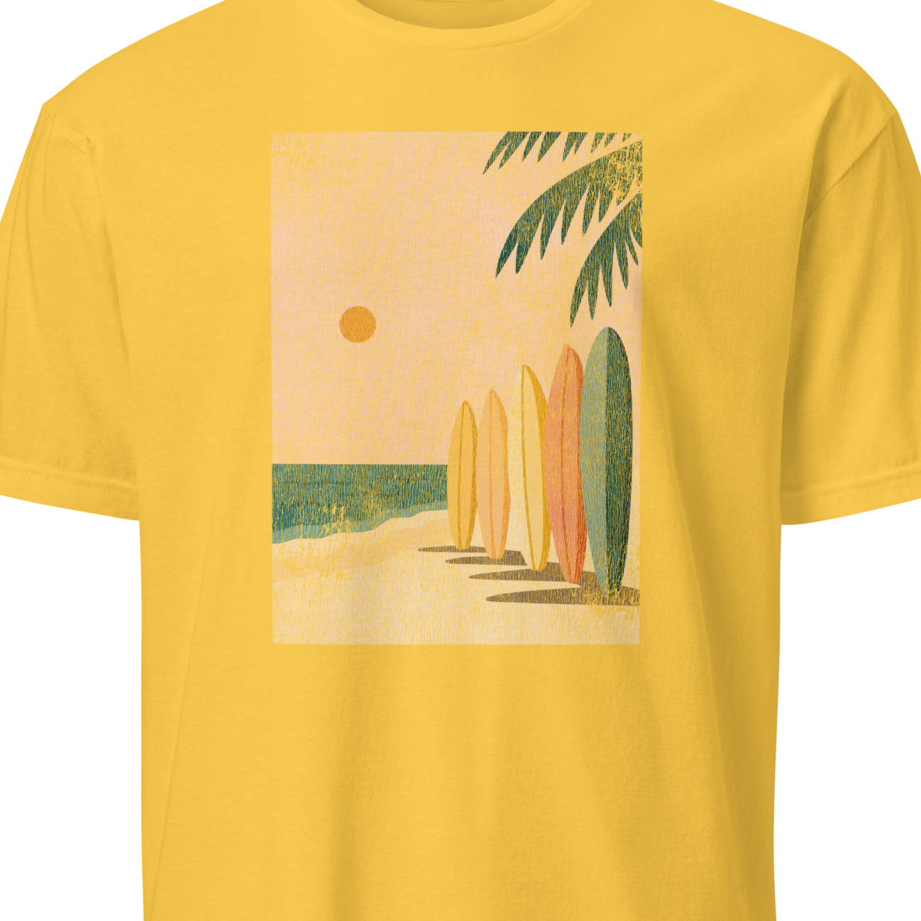 Yellow t-shirt with a graphic of surfboards and a palm tree 