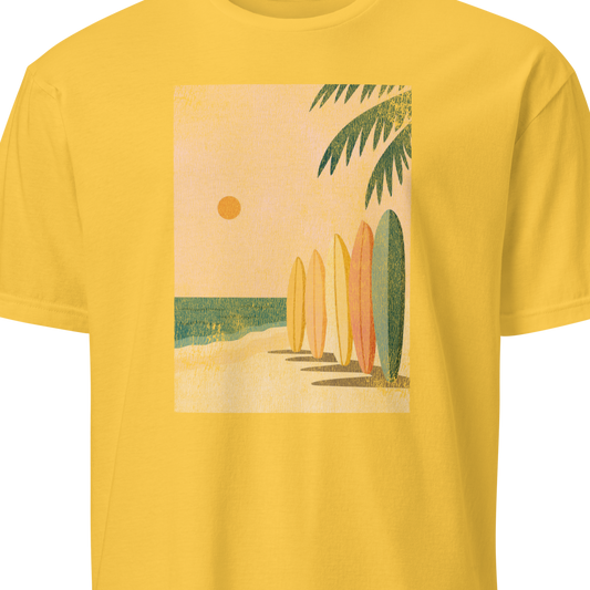 Yellow t-shirt with a graphic of surfboards and a palm tree 