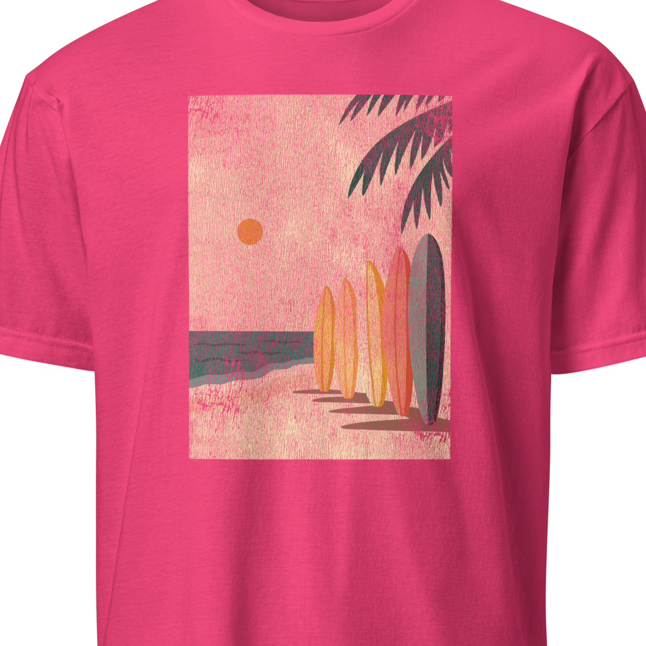Pink t-shirt with a beach graphic featuring surfboards and palm trees 