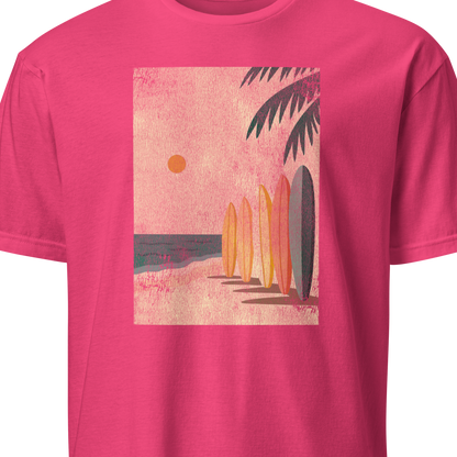 Pink t-shirt with a beach graphic featuring surfboards and palm trees 
