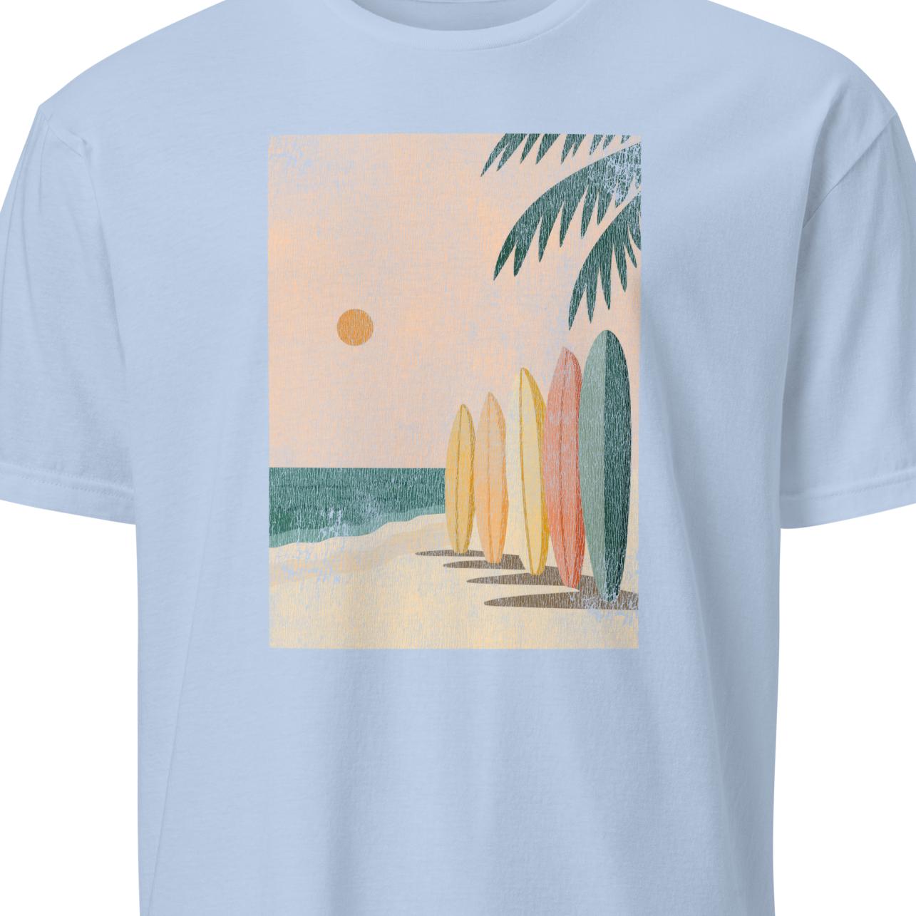 Light blue t-shirt with a graphic of surfboards and a palm tree 