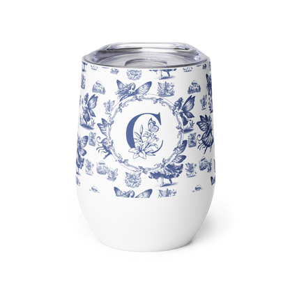 White tumbler with blue floral and butterfly pattern on a white background