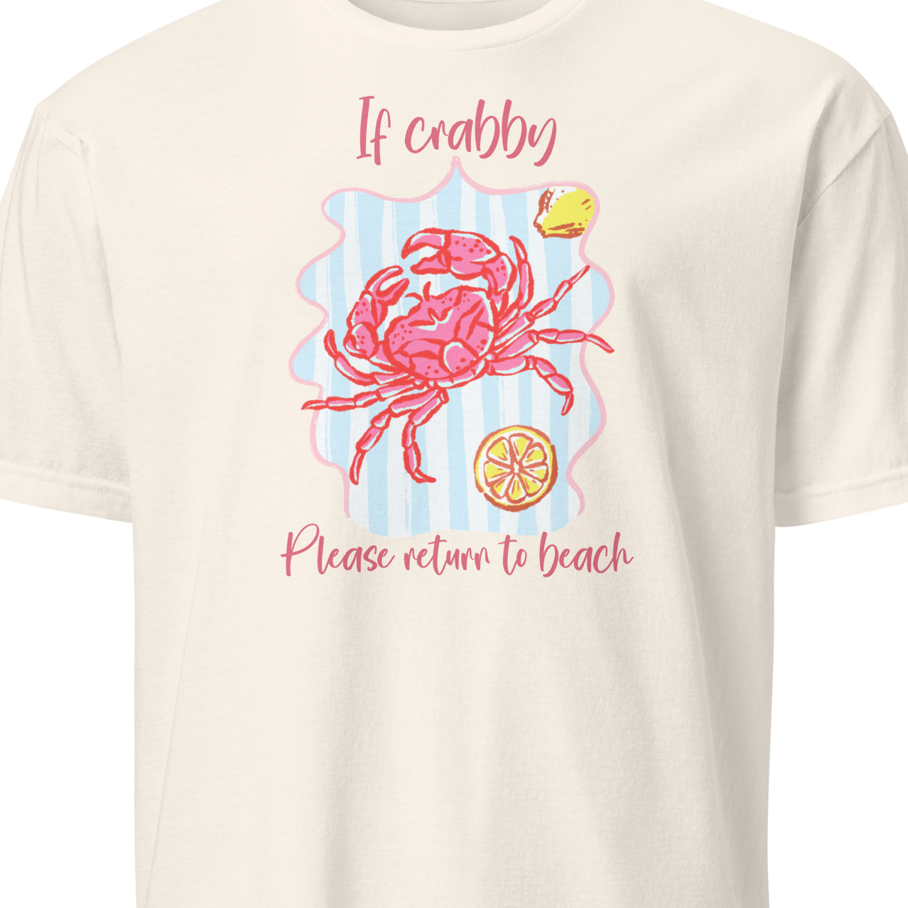 Beige t-shirt with a pink crab graphic and text 