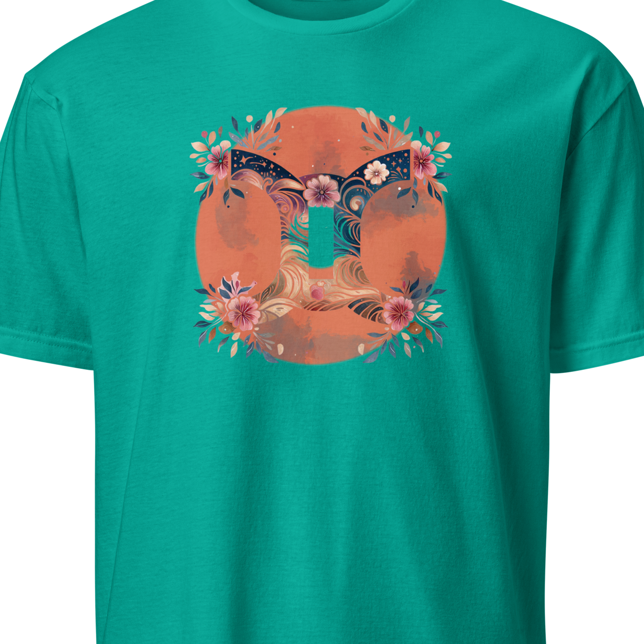 Teal t-shirt with a floral and gemini design on an orange circle