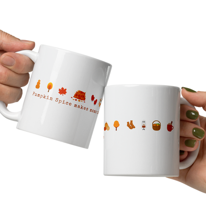 Two white mugs with autumn-themed designs held by hands on a white background