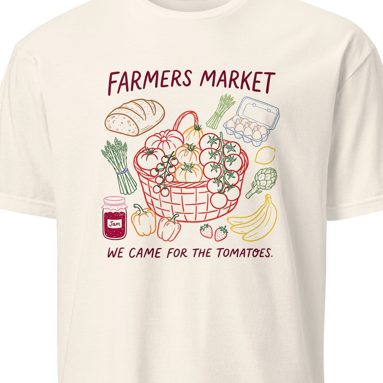 White t-shirt with a graphic of a farmers market basket and text 