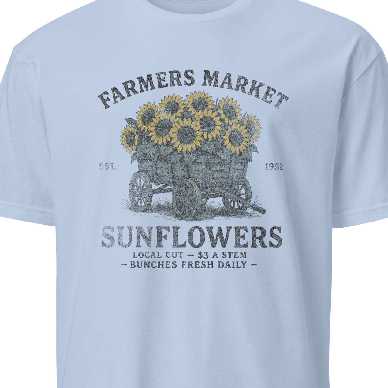 Light blue t-shirt with sunflower graphic and text 