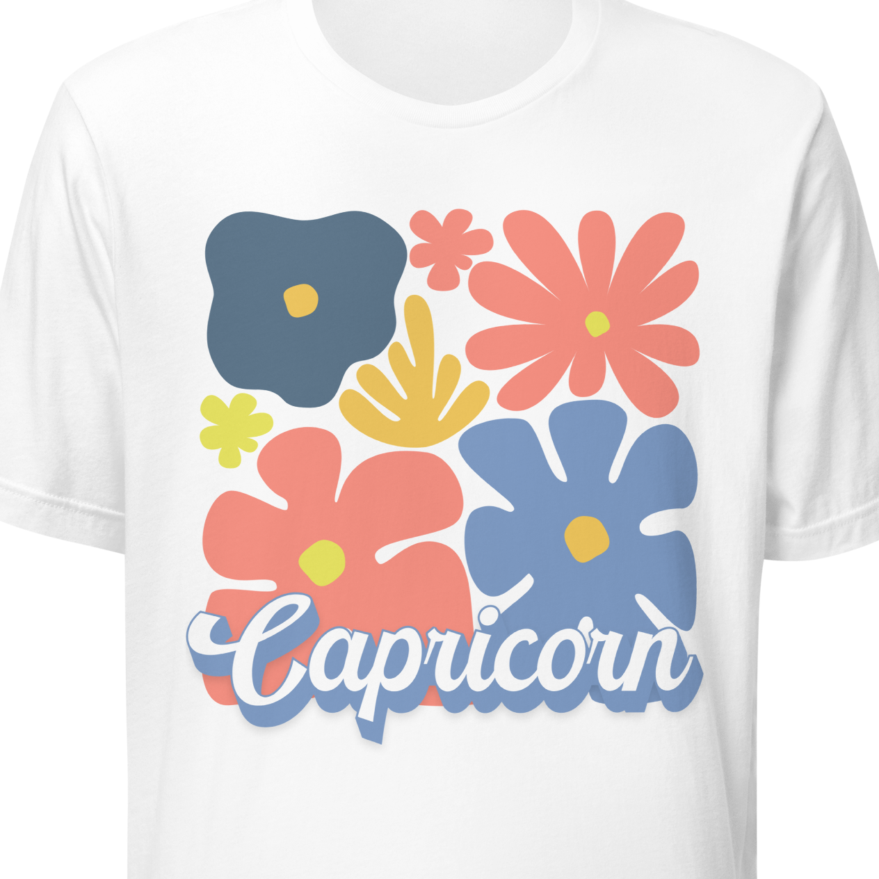 White t-shirt with colorful floral designs and 'Capricorn' text on a white background
