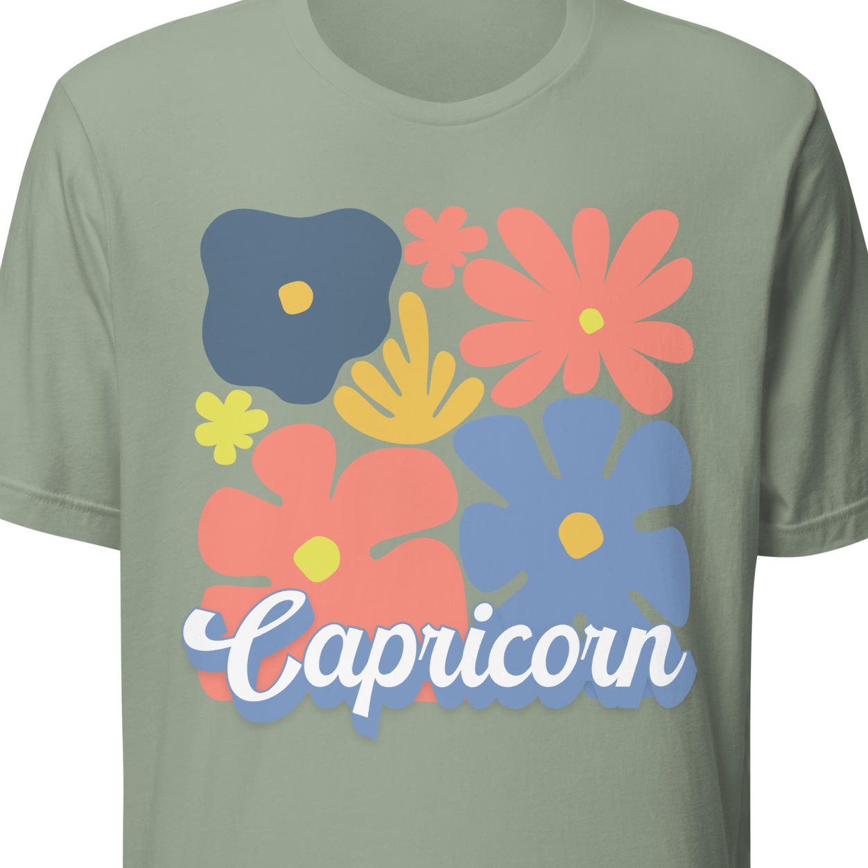 Green t-shirt with colorful floral designs and 'Capricorn' text 