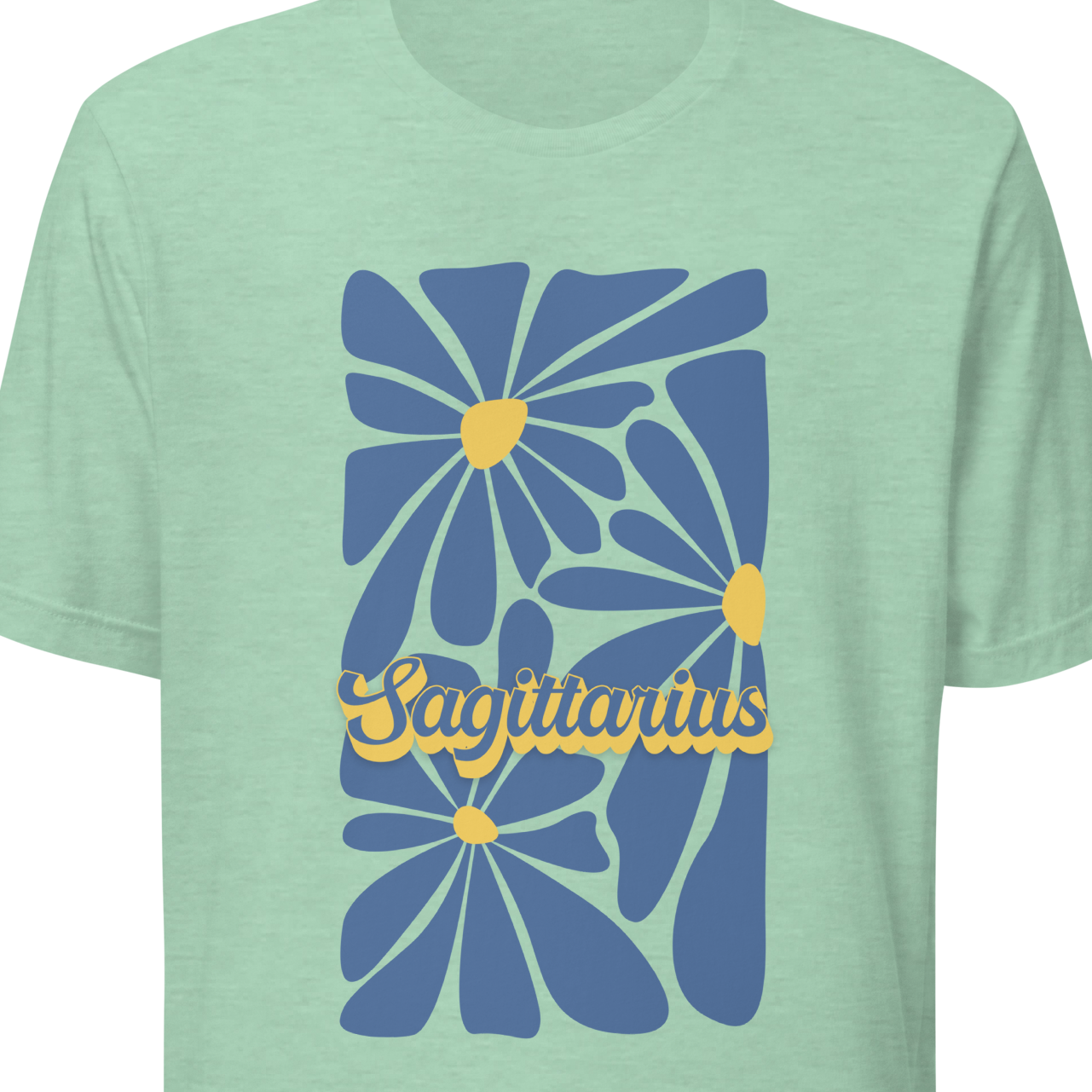 Light green t-shirt with blue floral design and 'Capricorn' text 