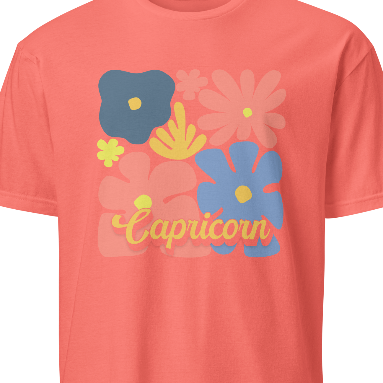 Coral t-shirt with floral designs and 'Capricorn' text on a white background