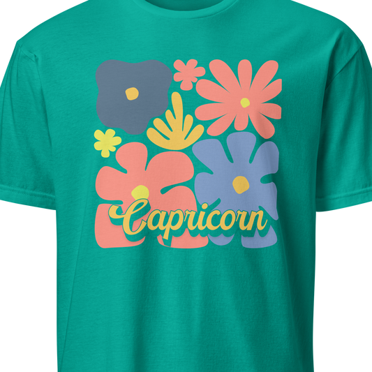Green t-shirt with colorful floral designs and 'Capricorn' text on a white background