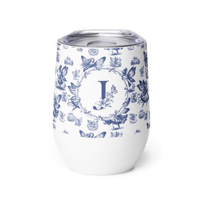 White tumbler with blue floral pattern and letter 'J' on a white background