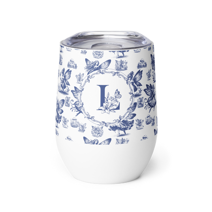 White tumbler with blue floral and butterfly pattern and letter 'L' on a white background