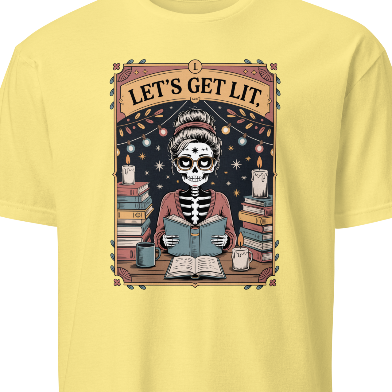 Yellow t-shirt with a skeleton reading a book graphic and 'Let's Get Lit' text