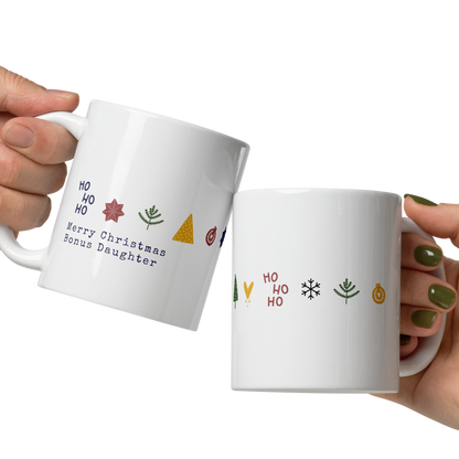 Two hands holding white mugs with decorative text and symbols on a white background