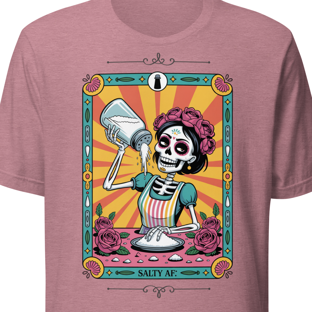 Pink t-shirt with a colorful graphic of a skeleton and roses 