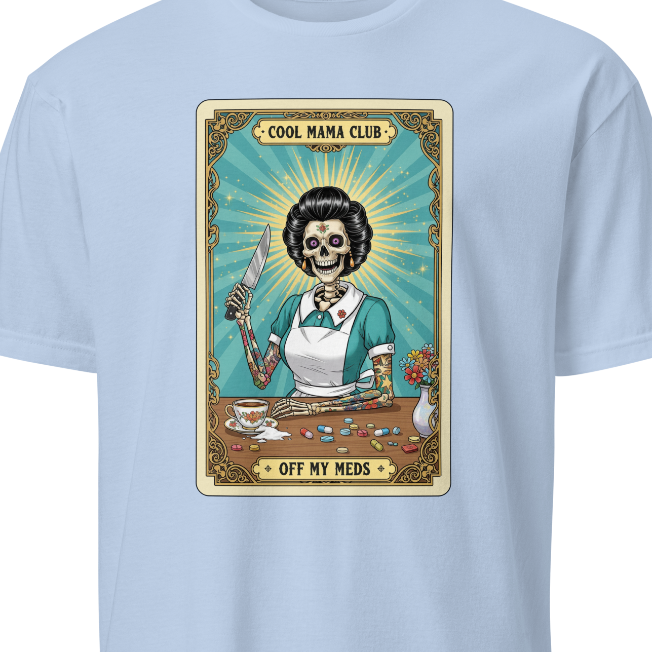 Light blue t-shirt with a graphic design featuring a skeleton in a kitchen setting 