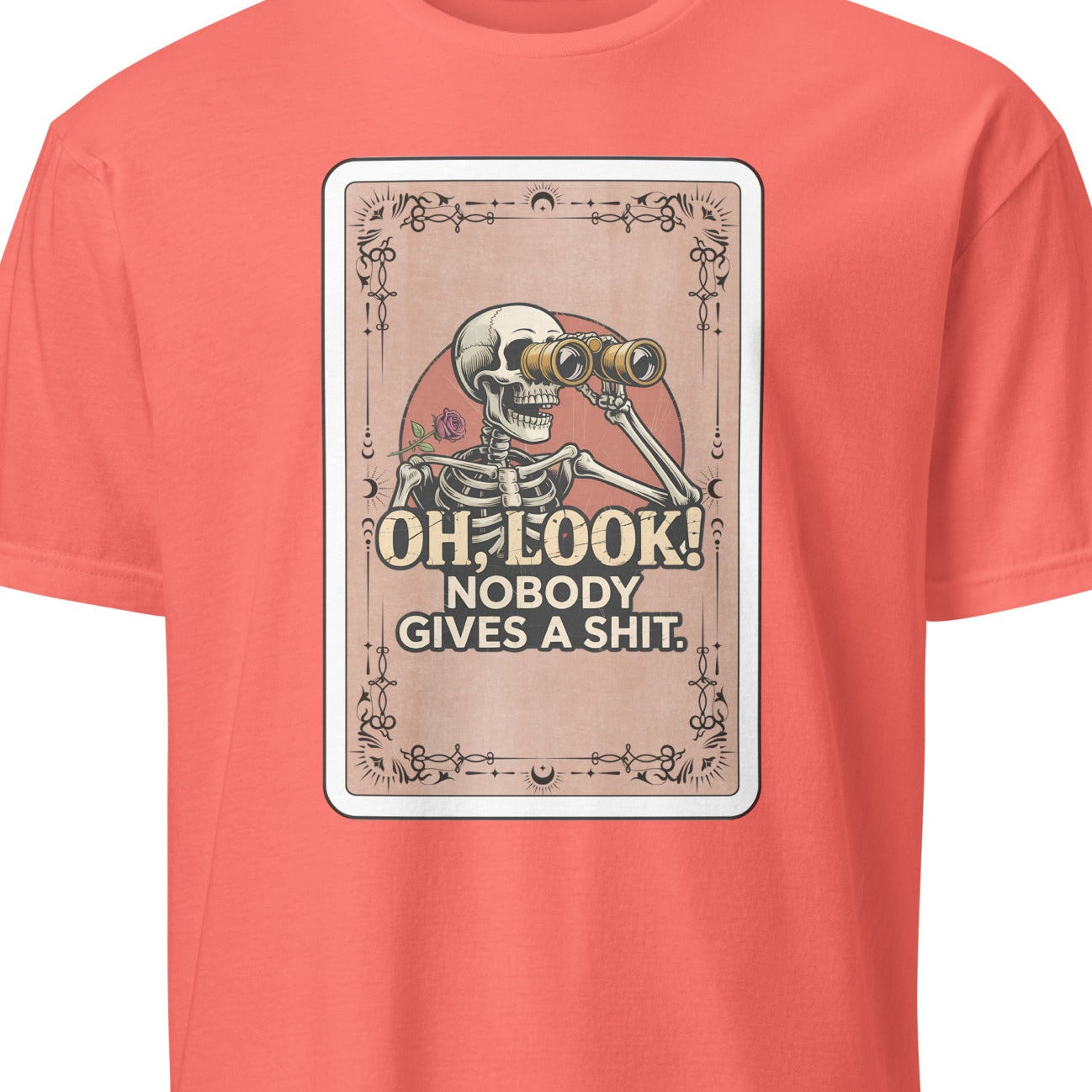 Coral t-shirt with a skeleton graphic and text on a white background