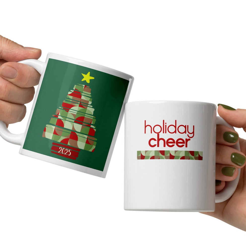 Two hands holding mugs with Christmas-themed designs on a white background