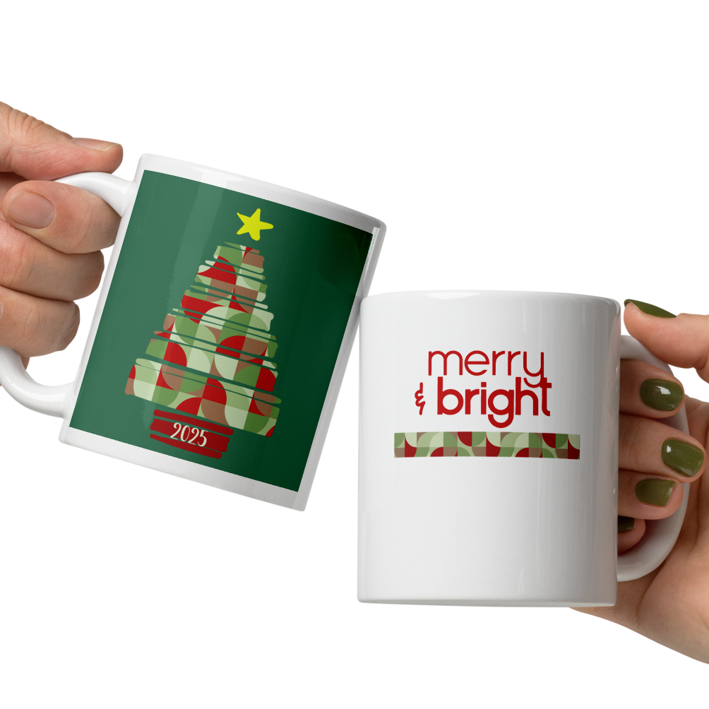 Two hands holding Christmas-themed mugs with tree and 'merry bright' designs.