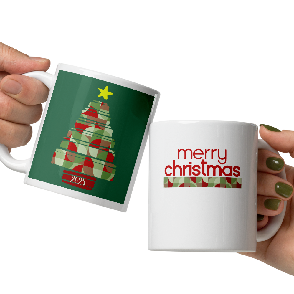 Two hands holding Christmas-themed mugs with tree and 'merry christmas' designs.