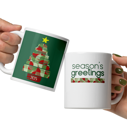 Two hands holding mugs with Christmas-themed designs on a white background