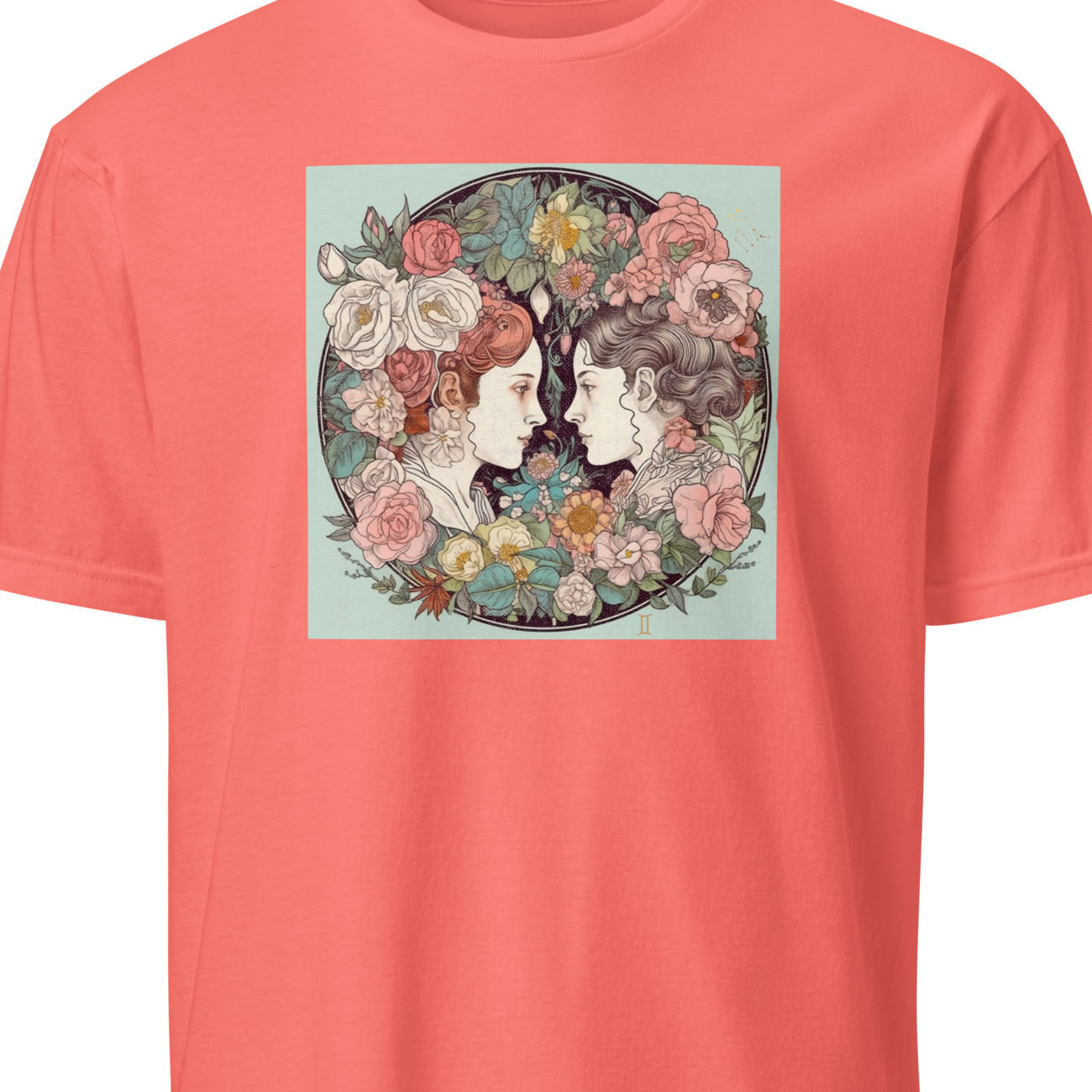 Coral t-shirt with a graphic of two faces surrounded by flowers on a white background