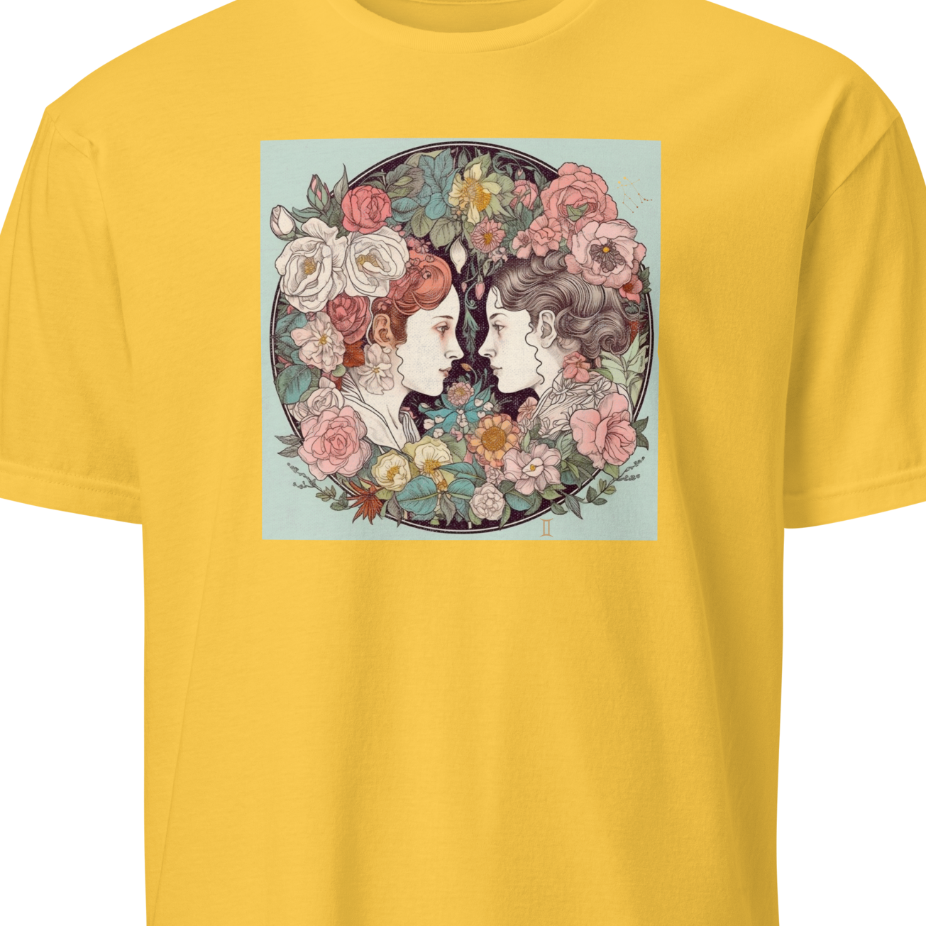 Yellow t-shirt with a graphic of two faces surrounded by flowers on a white background