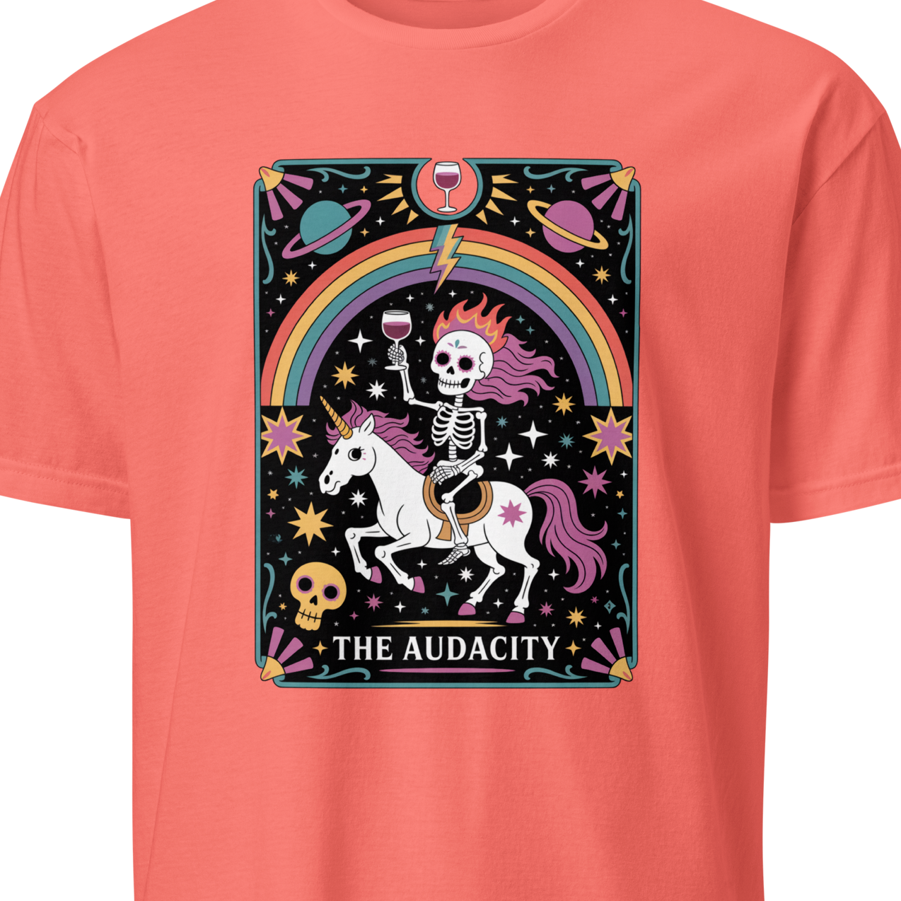 Coral t-shirt with a graphic design of a skeleton on a unicorn with a rainbow