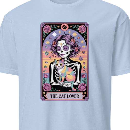 Light blue t-shirt with a colorful graphic of a skeleton holding a cat and the text 'The Cat Lover'