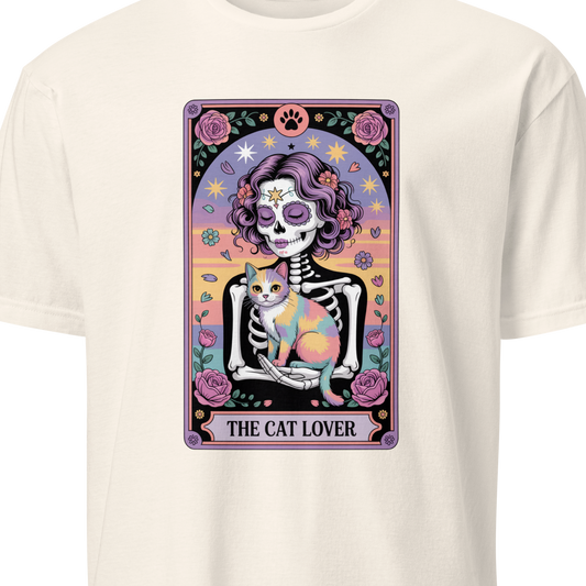 White t-shirt with a colorful graphic of a skeleton holding a cat and the text 'The Cat Lover' 