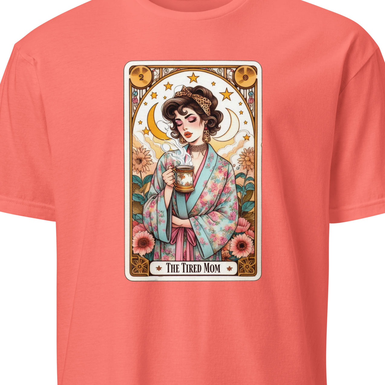 Coral t-shirt with a graphic of a woman holding a mug and text 'The Tired Mom' 