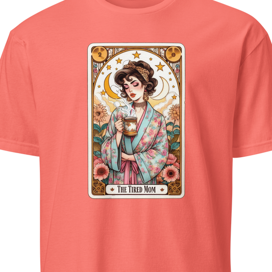 Coral t-shirt with a graphic of a woman holding a mug and text 'The Tired Mom' 