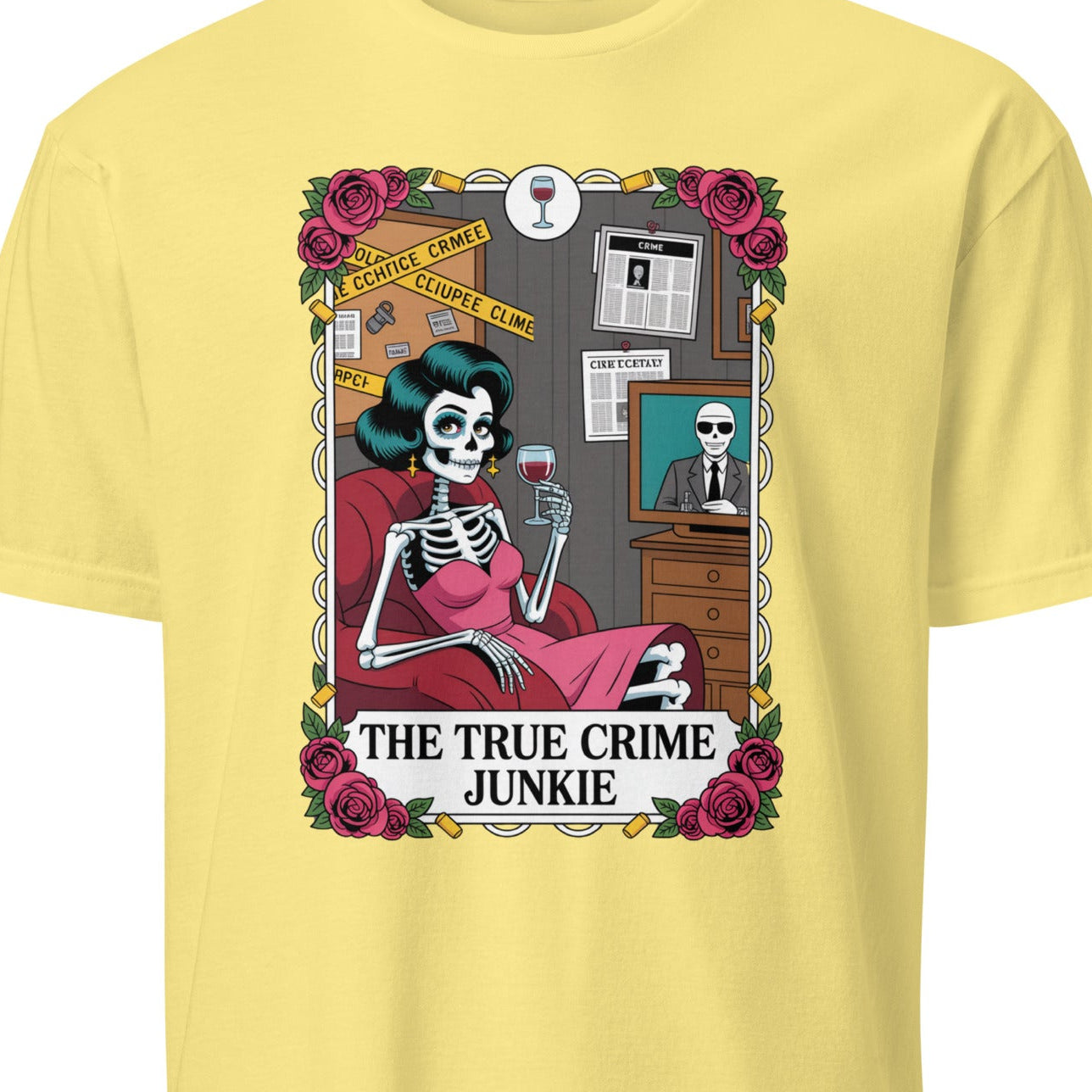 Yellow t-shirt with a graphic of a skeleton and text 'The True Crime Junkie' 