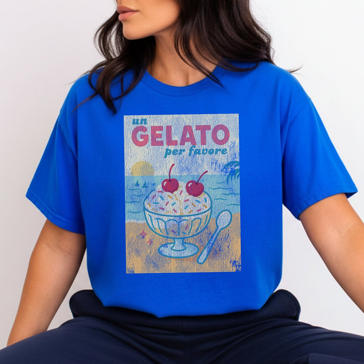 Person wearing a blue t-shirt with a gelato illustration and text.