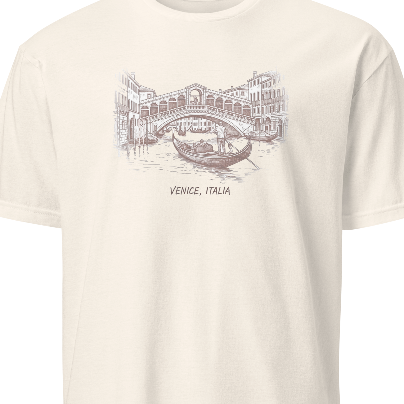 Beige t-shirt with a printed design of a bridge and gondola in Venice, Italy.