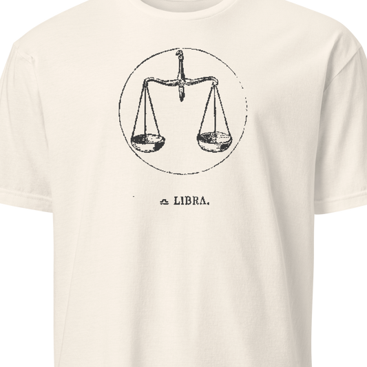 White t-shirt with black text and a picture of scales