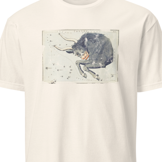 Beige t-shirt with a graphic of a cow on a white background