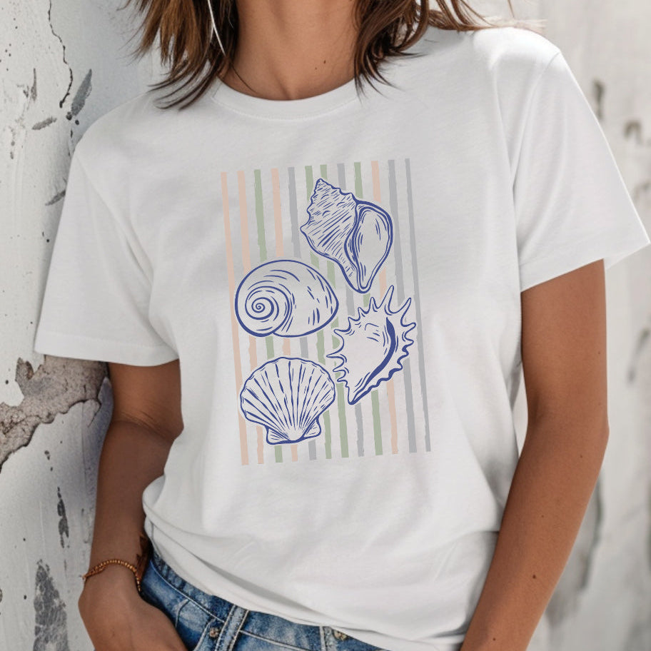 Person wearing a white t-shirt with shell design against a textured wall.